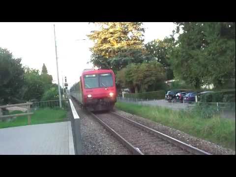 Train arriving at Meggen Zentrum, Switzerland