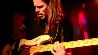 Sean McNabb of DOKKEN performs bass solo live July 19 , 2011 Milford , CT
