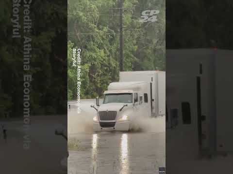 Truck Driver Scrambles Out of Cab as Vehicle Sinks in Texas Floods