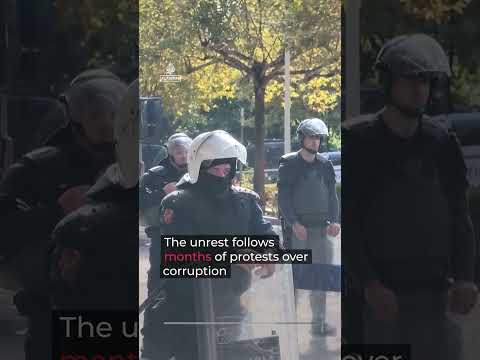 Albanian lawmakers scuffle in parliament as street protests continue