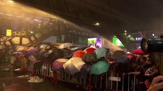 Thai police turn water cannon on defiant protesters