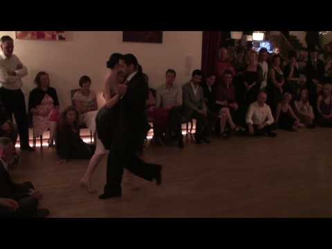  Adrian Costa  and  Amanda Costa  are  dancing  to  the  milonga  "  No Hay Tierra Como La Mia  "