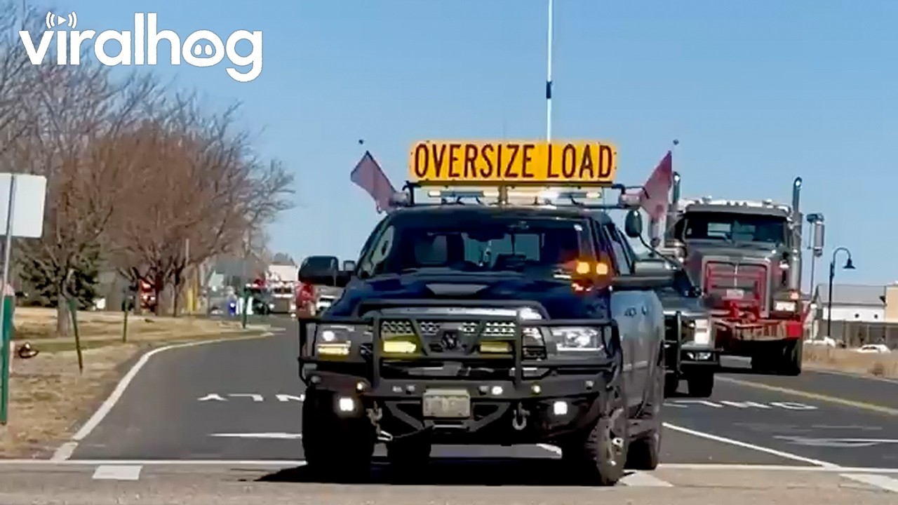 Massive Generator Convoy Navigates Tight Streets || ViralHog