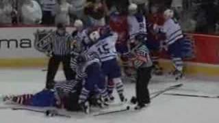 Alexei Kovalev elbows and fights Darcy Tucker