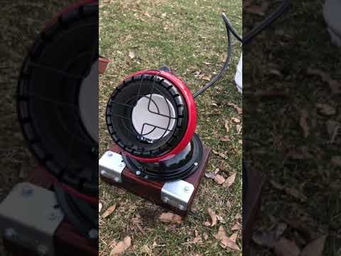 Homemade stand for Little Buddy Propane Heater attached to a 5 lb Growler propane tank: