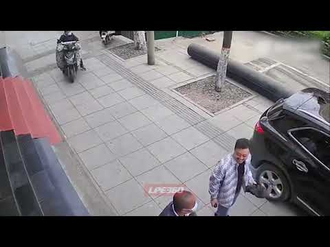 Cyclist hits open car door and falls