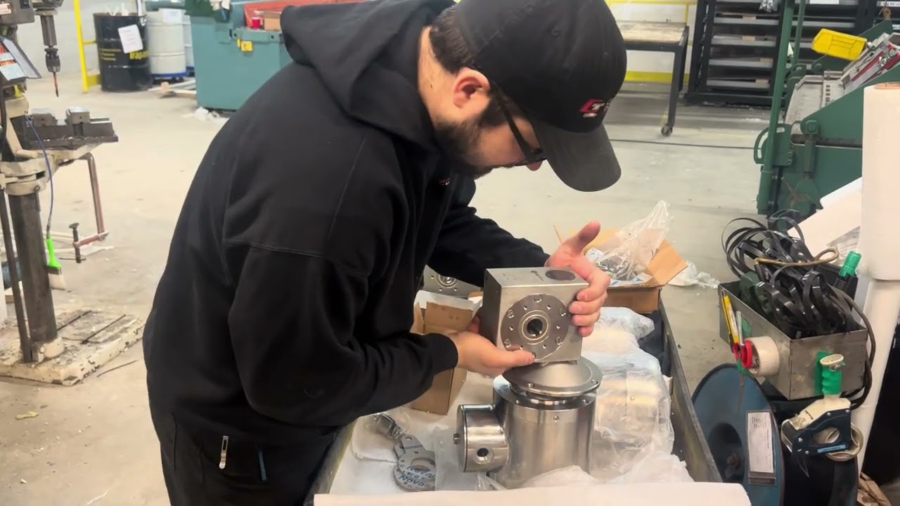 Assembly of a stainless steel Keltec washdown proof motor and gearbox.