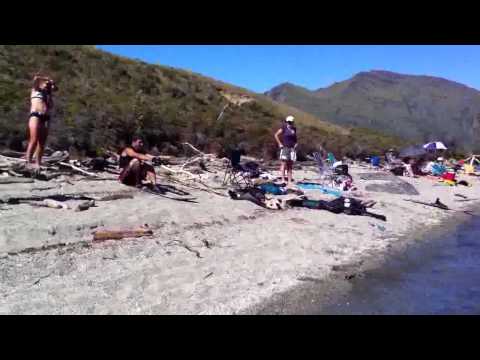 Single water ski start from up the beach