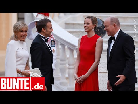 Fürstin in roter Traumrobe -  Beim Treffen mit den Macrons wirkt Charlène angespannt