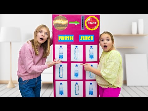 Amelia & Akim play with a toy vending machine