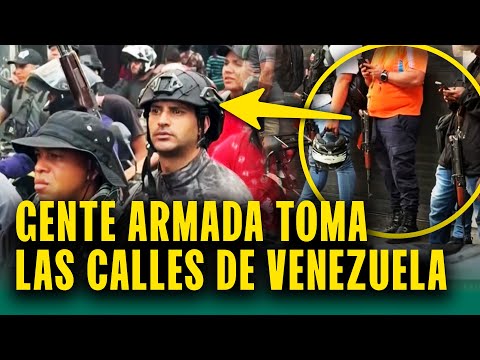 Gente con armas protesta en Caracas a favor de Maduro
