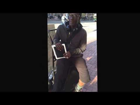 SF street music scene at its best: iPad musician, bucket drums, in front or Apple store