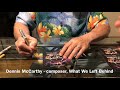 Dennis McCarthy signs CD inserts for What We Left Behind