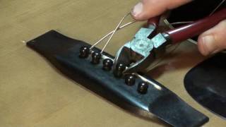 Tips for removing bridge pins on acousric guitar by Randy Schartiger Quick Clip Tips