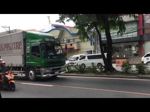 27 Dark Green and Silver Isuzu GigaMax Wing Van Truck in Congressional Ext.