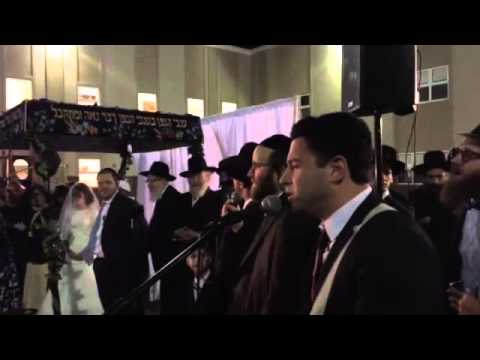 Yoeli Lebovitz and Eli Levin sing at the Chupa of Tani and Zahava Winner