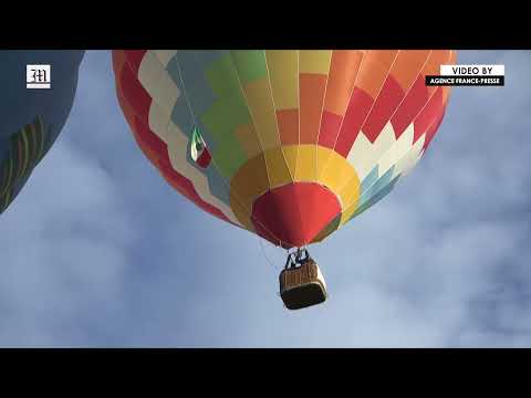 Hot air balloons colour the Mondovi sky in Italy