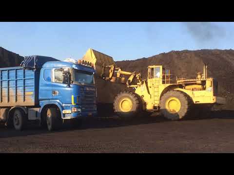 Caterpillar 992B Wheel Loader Loading Trucks With Coal