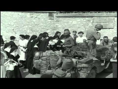 Catholic nuns speak to American soldiers in Broney, France during World War II. HD Stock Footage