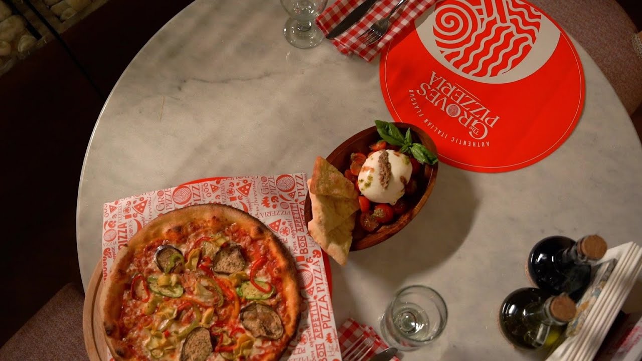 Taste authentic flavors of Italy at The Groves Pizzeria!