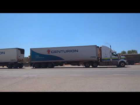 2 trailer Centurion truck leaving the Billabong Roadhouse (Western Australia)