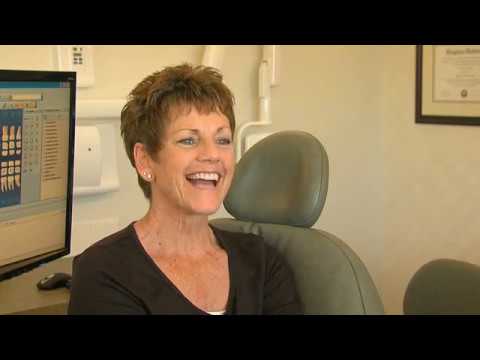 Smiling woman in black blouse in Moses Lake dental office