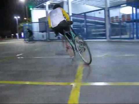 Over-bar skid to grab a bottle on the flat.