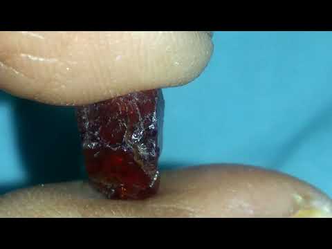 Rough red gem Stone ( diamond )
