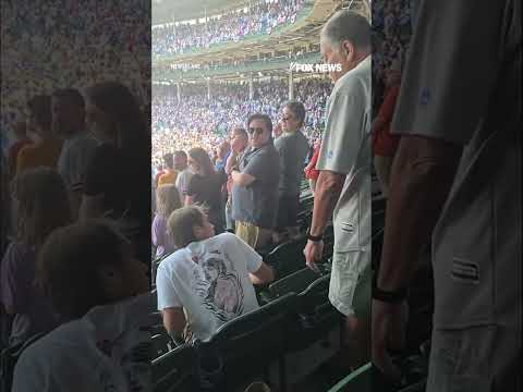 WATCH: Cubs fan SLAPS spectator during national anthem