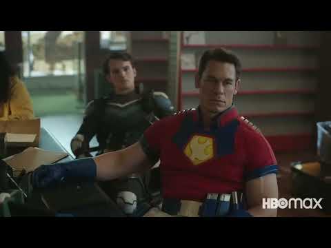 Applause-beat mid-trailer; cut lands on cymbal crash, Cena helmet glare