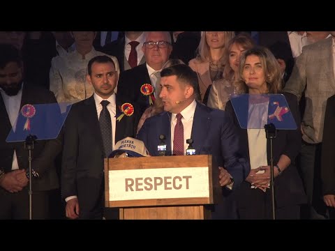 Romania's George Simion arrives for his speech after the election | AFP