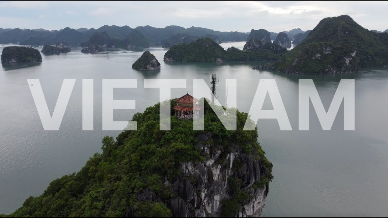 Tourists explore Ti Top Island, renowned for its crescent-shaped beach, panoramic views, and tranquil surroundings in Ha Long Bay.