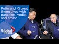 Vladimir Putin and Xi Jinping treat themselves with pancakes, vodka and caviar