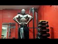 black man flexing muscles after workout