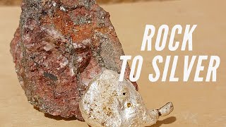 Silver ore as a natural deposit or recoverable silver-containing rock.