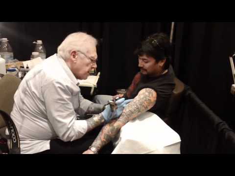 Lyle Tuttle tattooing Jamie Izumi