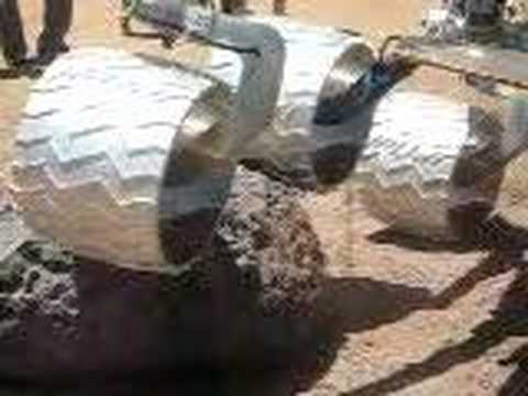 Mars Science Laboratory wheels roll over rocks