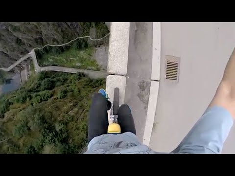This guy unicycled along the edge of a giant dam