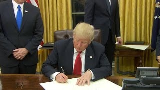 Watch: Trump signs executive orders on first day a