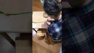 How to present Montessori beading activity to toddlers.