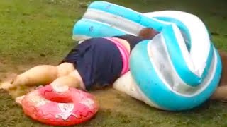 WOMAN SLIDES INTO A POOL! | WATER SLIDE FAILS