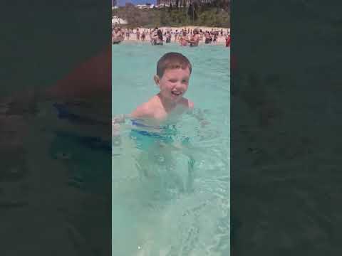 Zack swimming in Horseshoe Bay Beach Bermuda. Autism on the Seas. May 2024. Liberty of the Seas
