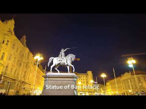 Caminhada em Zagreb: Praça Ban Jelacic à noite, quarta-feira, início de abril de 2022. 4K
