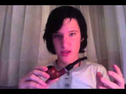 Pfeife Stopfen und Rauchen