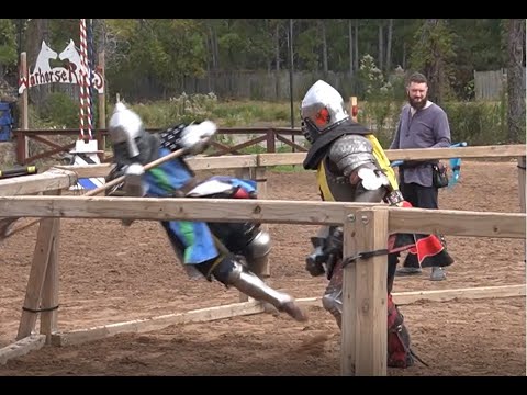 Armored knights in an Axe fight at the Texas Renaissance Festival ends with pommel strike