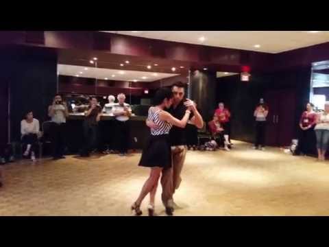  Jonathan Saavedra  and  Clarisa Aragon  are  dancing  to  "  Recuerdos de la Pampa  "  by  Juan D'Arienzo  at  Toronto Tango Festival  in  2016