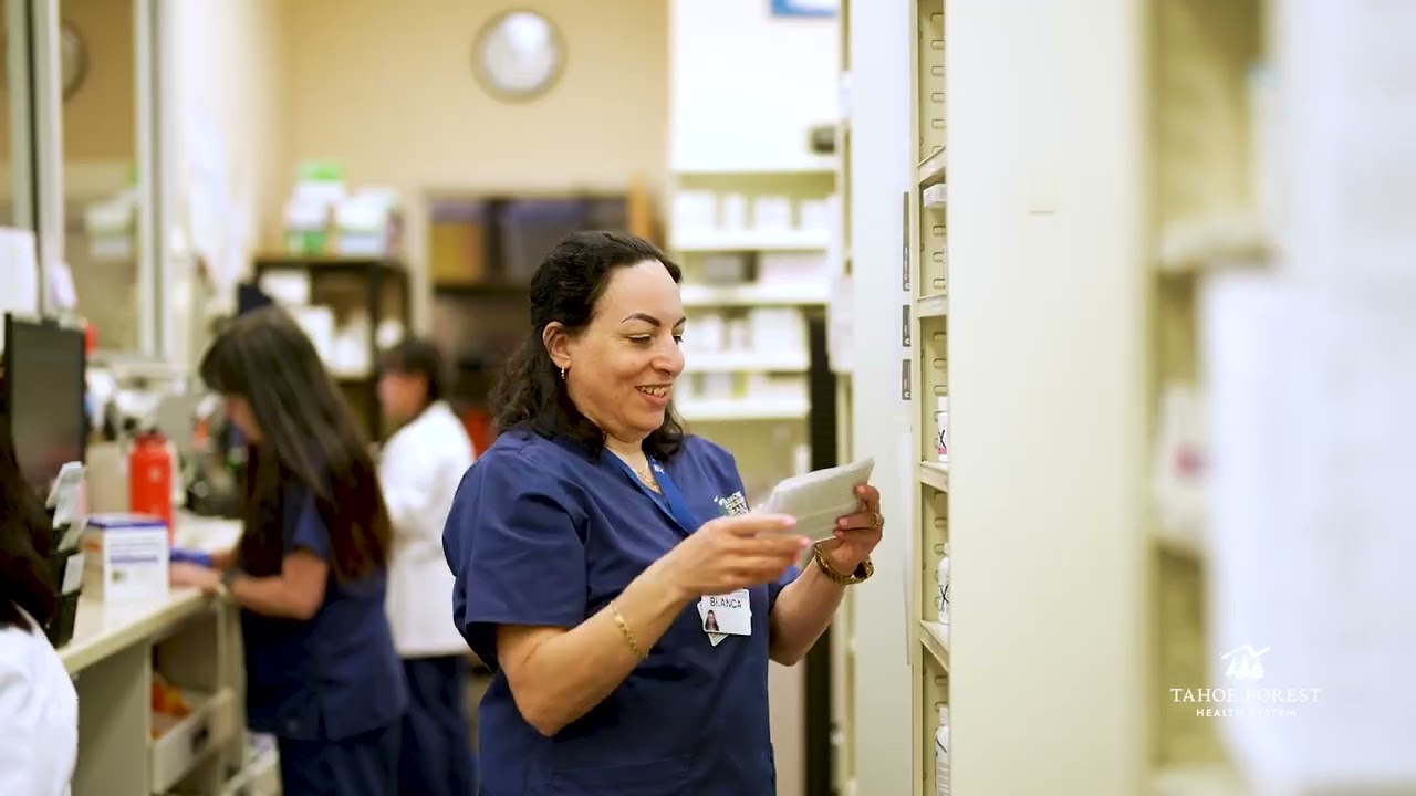 Pharmacist reviewing a prescription in a pharmacy