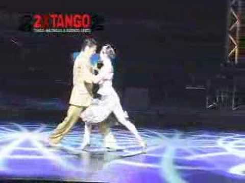  Kyoko Yamao  and  Hiroshi Yamao  are  dancing  to  the  tango  "  Mala Junta  "