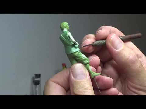 Sculpting the coat on a 65mm figure