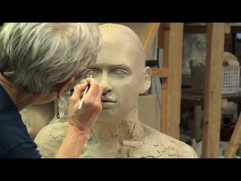 Tip Toland sculpting a bust at Seward Park Clay Studio